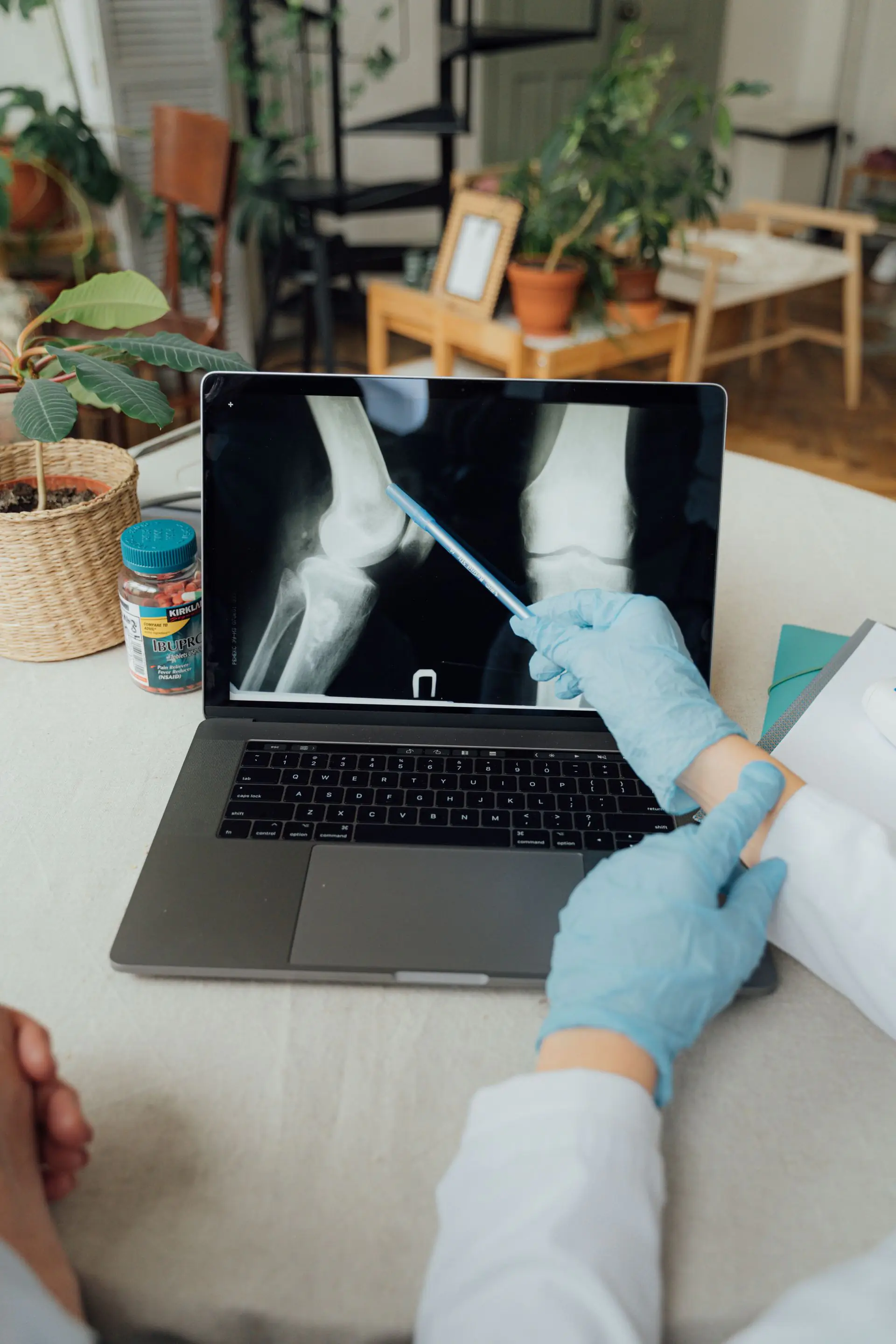 Doctor examining a patient s knee before knee replacement